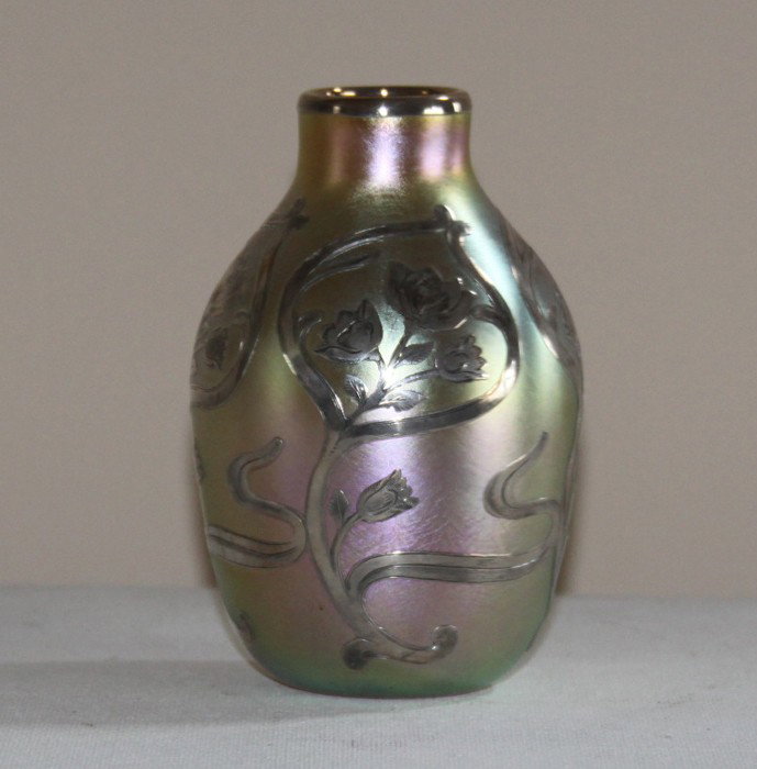 Stunning Quezal sterling silver overlay vase: Stunning Quezal sterling silver overlay vase. Most likely the overlay work done by Alvin around the late teens to early 1920's. Gorgeous gold with a great iridescent hues of magenta, peacock blue and