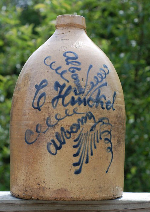 New York merchant Country Store advertising jug: Very rare New York merchant Country Store advertising jug. Unusual spiral tornado decoration and merchant name "E. HINKEL" decorated in cobalt blue. A number 2 size jug from the late 1800's. Very good