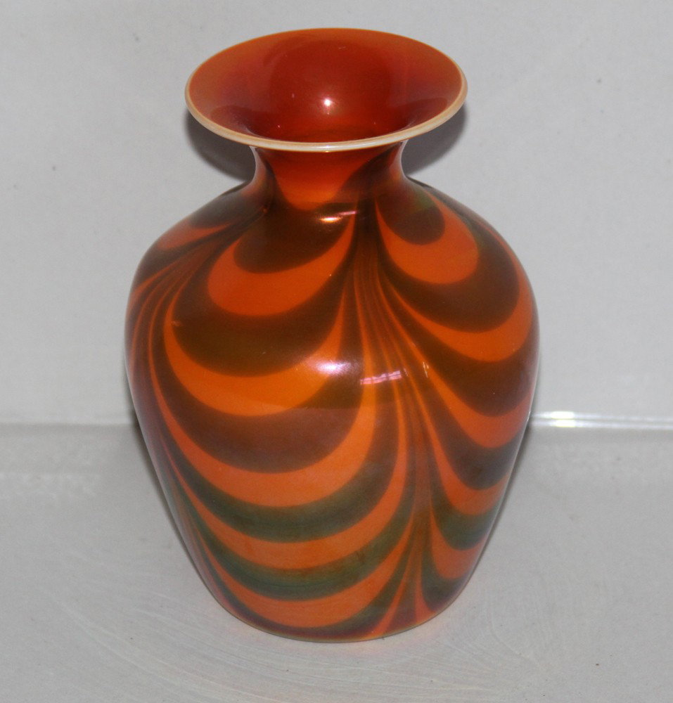 Imperial Free Hand draped loop vase: ovoid shouldered form in mirror orange decorated with blue seags. 6 1/2" tall. Good condition.