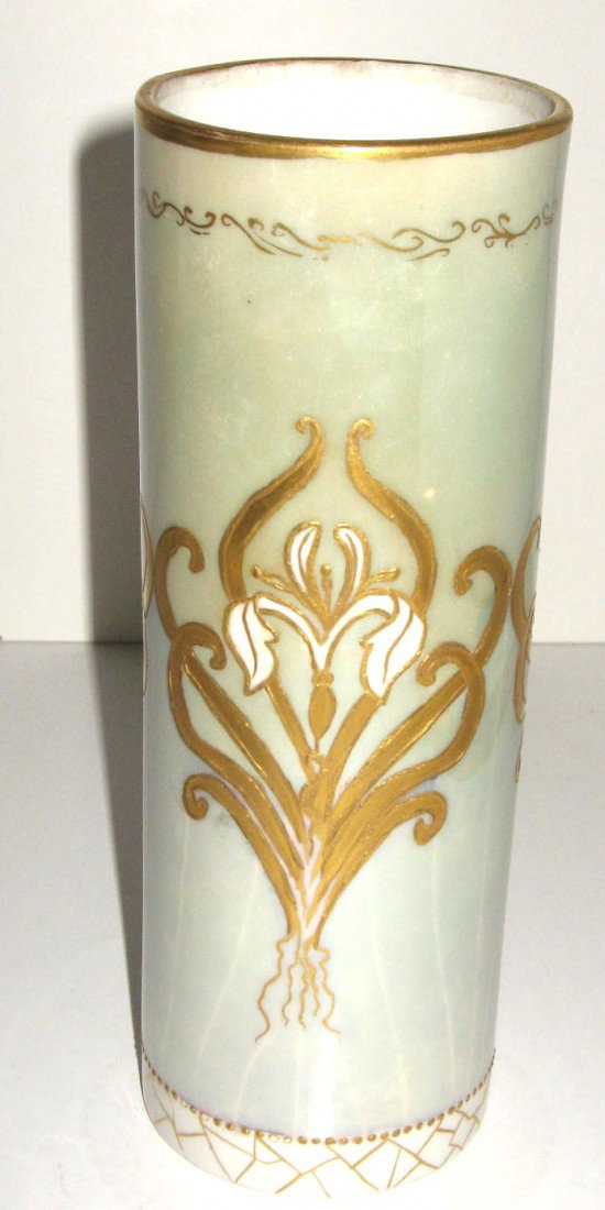 Limoges French porcelain vase,: cylindrical form in green decorated with three white iris with gilt stems, signed Limoges 7 1/2" ht. Condition: good with minor enamel loss