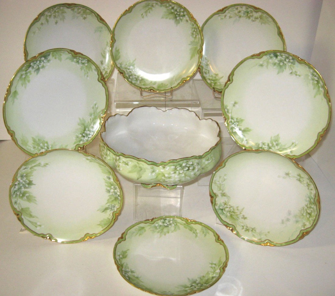 9 piece Haviland Limoges dessert set,: including a large berry bowl and eight matching 8 1/2" wide plates all in the Marlin pattern, marked, bowl 10" wide. Condition: good no damage.