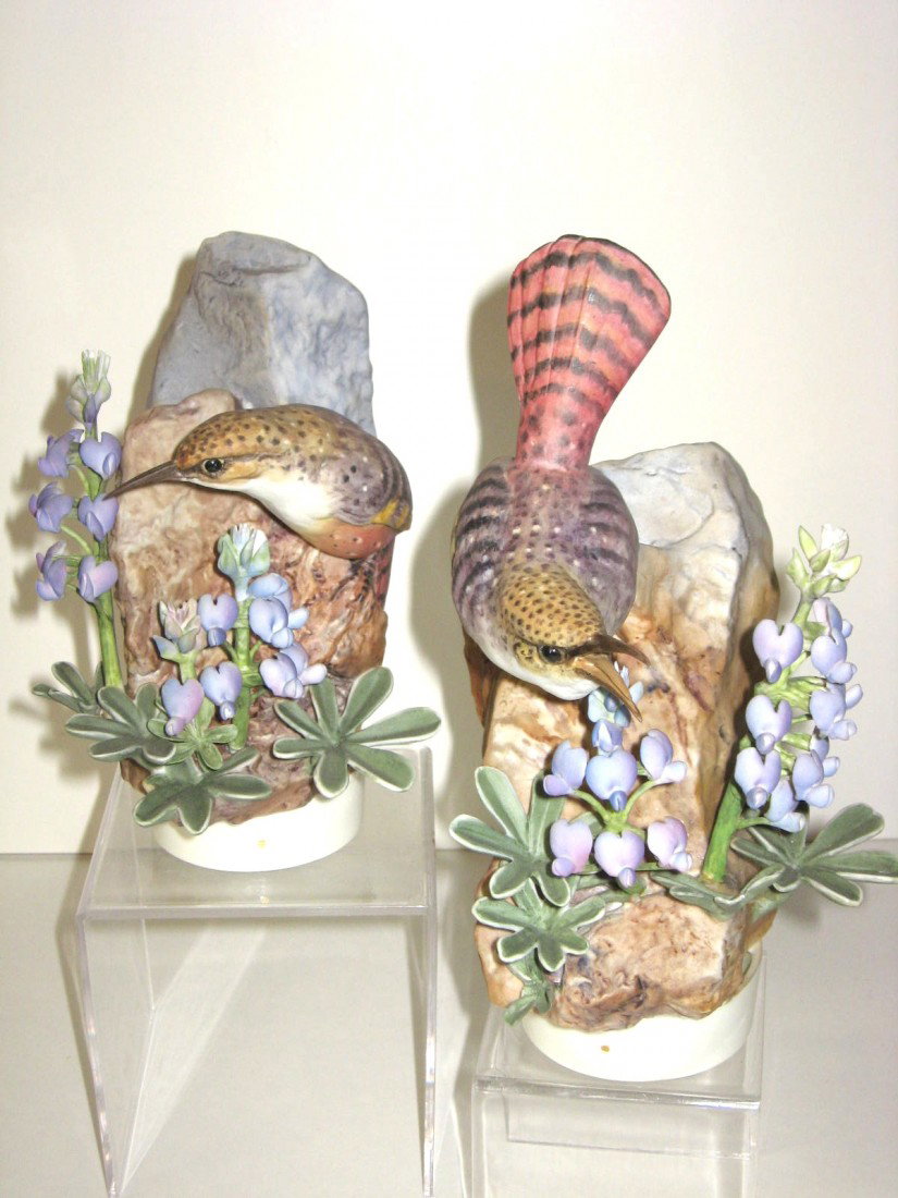Pair of Royal Worcester Doughty birds,: of a cock and hen of the Canyon Wren, signed with factory stamp Dorothy Doughty, 9" ht. Condition: small loss of leaf.