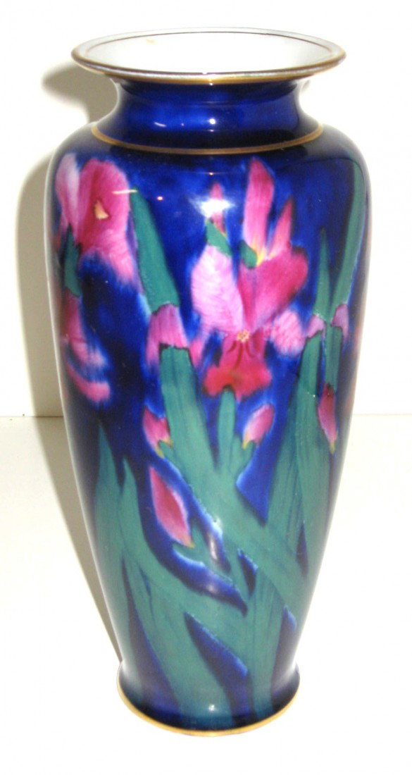 George Jones Imperial Rouge vase,: cylindrical form in blue decorated with red iris on green leafy stems, signed JG Imperial Rouge England, 10" ht. Condition: good with no damage.