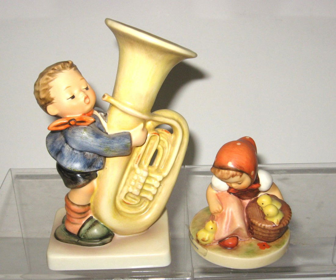 2 Hummel figurines,: including #437 Tuba player, and #57 2/0 chick girl, TMK 6, tallest 6 1/4" ht. Condition: good with no damage.