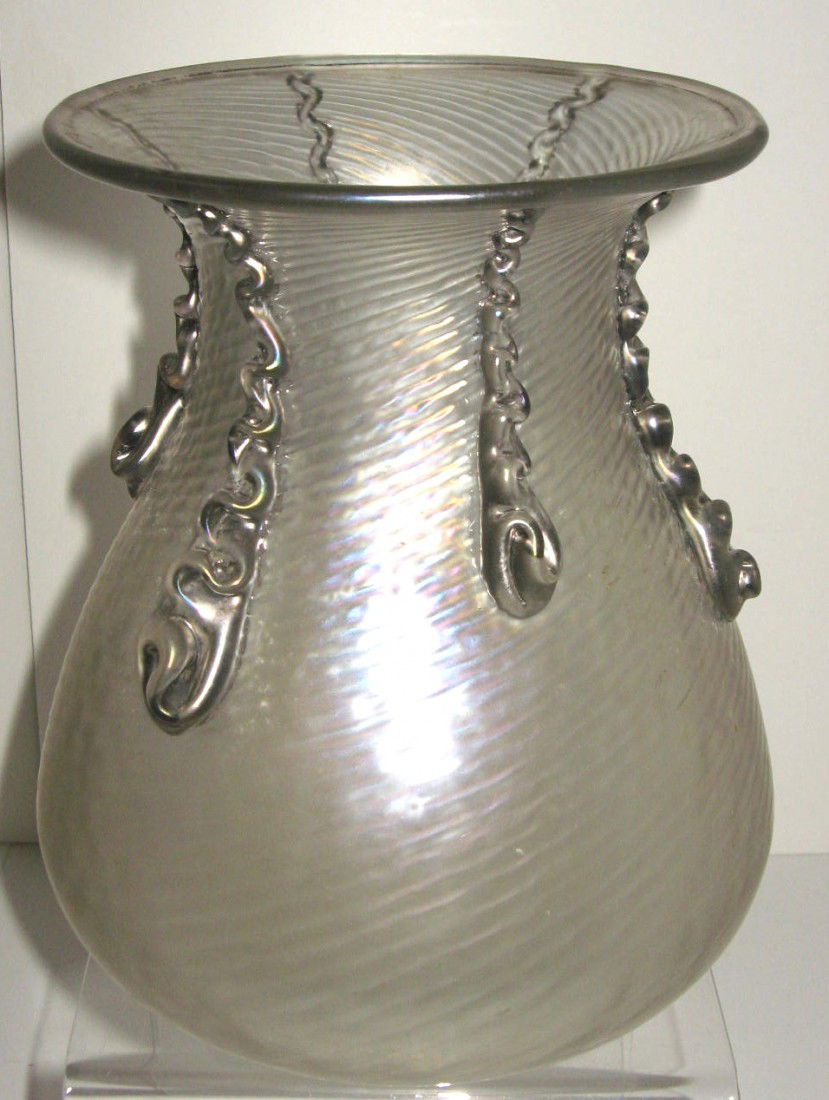Large Loetz iridescent glass vase,: swirled Verre-de-Soie body decorated with applied silver drippings, the rim with silver lip wrap, 8" ht. Condition: good with no damage Estimate: 400-600