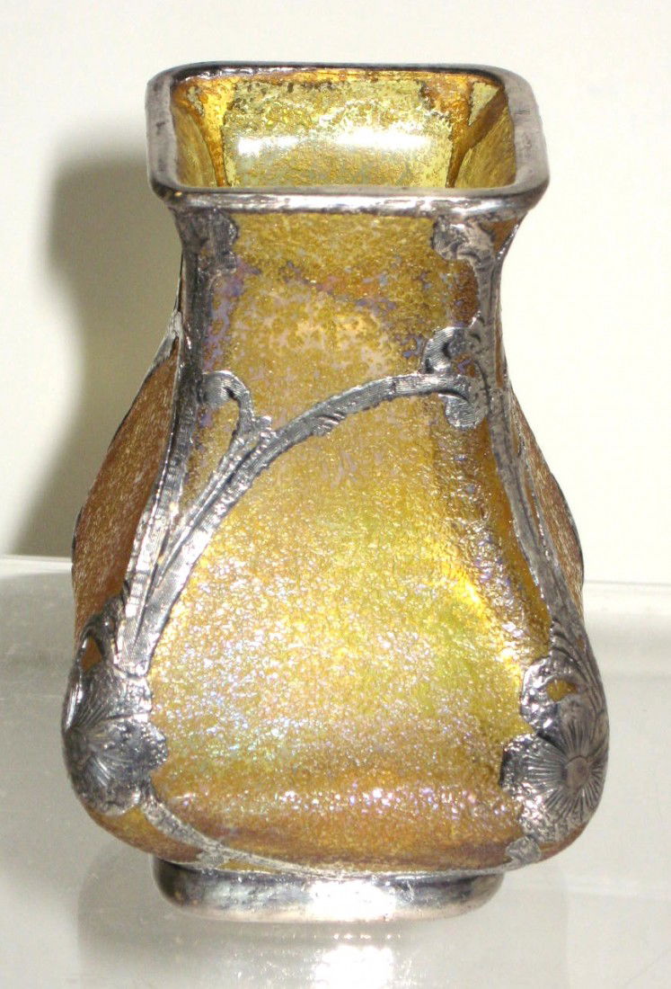 Loetz silver overlay vase,: rectangular form in amber textured glass with rich blue hues, adorned with a silver overlay Art Nouveau scrolling with corner flowers, 3 3/4" ht. Condition: good with no damage