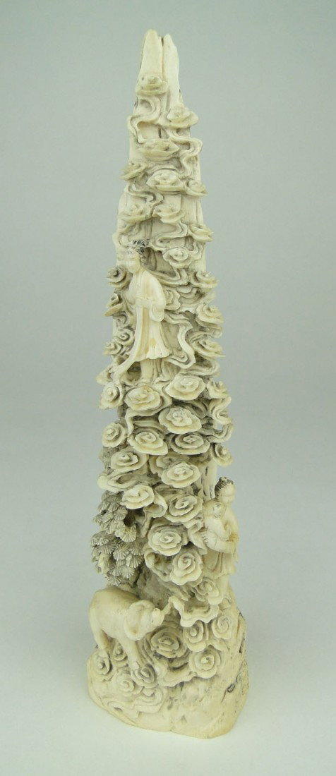 LARGE ANTIQUE ORIENTAL IVORY GROUPING: LARGE ANTIQUE ORIENTAL IVORY GROUPING Carved out of one Tusk Depicting a Family Quin Yin Man Holding Baby and the Family YaK Signed in Red to Base and in Black to the Base Approximately 10 Inches Tall