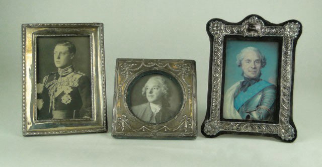 3 VINTAGE ENGLISH STERLING SILVER PICTURE FRAMES: 3 VINTAGE ENGLISH STERLING SILVER PICTURE FRAMES all Hallmarked Solid one is EFB Anchor Lion Passant and M. Fancy one JBL D Lion Passant Panther K. Square one HM Anchor Lion Passant & h. Largest being