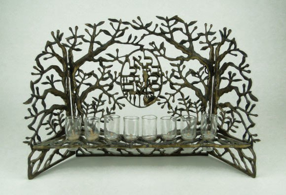 LARGE BRONZE UNIQUE MENORAH: LARGE BRONZE UNIQUE MENORAH Medallion in Middle Hebrew Writing in Amongst the Trees Measuring 13 Inches Across 9 Inches Tall Signed in Hebrew 50/180 Very Good Condition, WE WILL NOT SHIP THIS ITEM, CA
