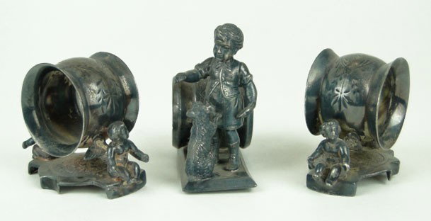 3 19TH C FIGURAL NAPKIN RINGS: 3 19C FIGURAL NAPKIN RINGS Pair of Webster Silver Plate with Two Putti and a Meridian Silver Plate Vintage Boy with his Dog, SHIPPING TO BE $20 PLUS INS