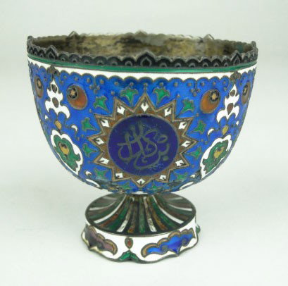 ANTIQUE PERSIAN ENAMELED FOOTED CUP: ANTIQUE PERSIAN ENAMELED FOOTED CUP Beautiful Enamel Work in Abstract Design Blue Ground Red Green White accent Standing 2 Inches Tall 2-1/2 Inches Wide, SHIPPING U.S. TO BE $20 PLUS INS