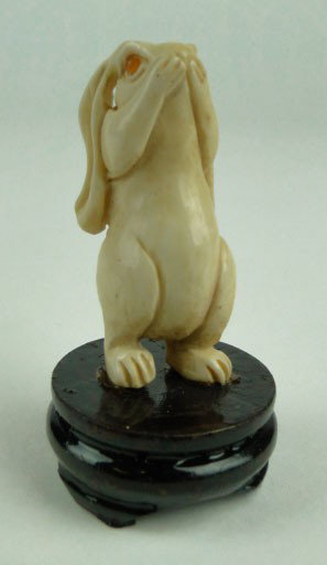 ANTIQUE CHINESE CARVED IVORY BUNNY RABBIT: ANTIQUE CHINESE CARVED IVORY BUNNY RABBIT, Approximately 2 Inches Tall on Wood Base with Two Carnelian Eyes, shipping u.s. to be $20 plus ins