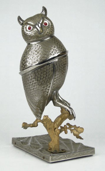 LARGE VINTAGE SILVER OWL MUSIC BOX Owl: LARGE VINTAGE SILVER OWL MUSIC BOX Owl opens up to a Covered Box and has Ruby Glass Eyes Measures Approximately 9 Inches Tall and sits Upon a 3 Inch Branch Mounted onto a Silver Plated Base Very Good 