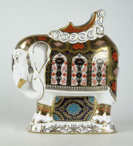 ROYAL CROWN DERBY PAPERWEIGHT ELEPHANT GUMPS EDITI: ROYAL CROWN DERBY PAPERWEIGHT FIGURINE GUMPS LIMITED EDITION ELEPHANT aprox 8 1/2" tall signed base gold button, signed by Hugh Gibson, director of Royal Crown Derby, limited to 100 pieces #73/100, SH