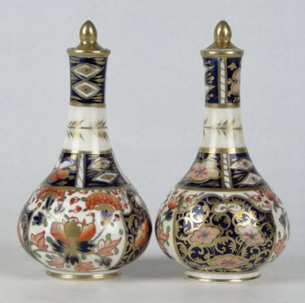ANTIQUE CROWN DERBY PR OF MATCHING SCENT BOTTLES: ANTIQUE CROWN DERBY PR OF MATCHING SCENT BOTTLES both in the Imari pattern with small daubers crown mark to base, each aprox 5" tall, very good condition, SHIPPING $25 PLUS INS