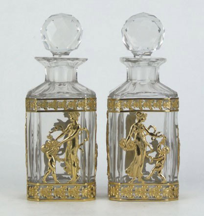 PAIR BRONZE GILT EARLY FRENCH CRYSTAL PERFUME BOTT: PAIR BRONZE GILT EARLY FRENCH CRYSTAL PERFUME BOTTLES with Rap Around Bronze Gilt of Roman Women & Puttis Each Measures Approximately 7 Inches Tall, SHIPPING $45 PLUS INS