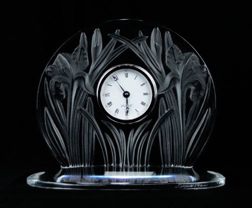LARGE LALIQUE FLORAL IRIS CRYSTAL CLOCK: LARGE LALIQUE FLORAL IRIS CRYSTAL CLOCK With Floral Design in Relief of Iris Measures Approximately 8 Inches Wide 7 Inches Tall Very Good Condition Signed to Base, SHIPPING $40 PLUS INS