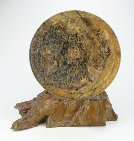 ANTIQUE CARVED CHINESE AGATE DISPLAY: ANTIQUE CARVED CHINESE AGATE DISPLAY Circa 1920's Detail Carving of Dragons & bird of Paradise with Concentric Call in the Middle Comes with Petrified Wood Stand Measures Approximately 16 Inches in Di