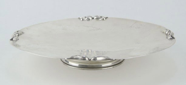 HEAVY STERLING SILVER DANISH FOOTED CAKE PLATE: HEAVY STERLING SILVER DANISH FOOTED CAKE PLATE Designer Peterson hand Made with Flower Accent Approximately 10 Inches Wide Approximately 14 Troy Ounces, SHIPPING $40 PLUS INS