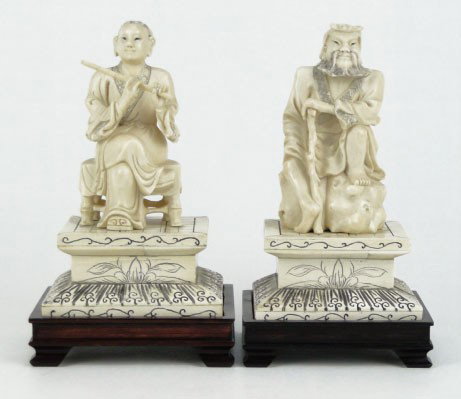 SET CHINESE IVORY MALE & FEMALE ELDERS: SET CHINESE IVORY MALE & FEMALE ELDERS Consisting of Man with Beard Sitting on Rock & Holding a Stick and a Woman Sitting on a Garden Seat Playing the Flute Each Measures Approximately 7 Inches Tall o