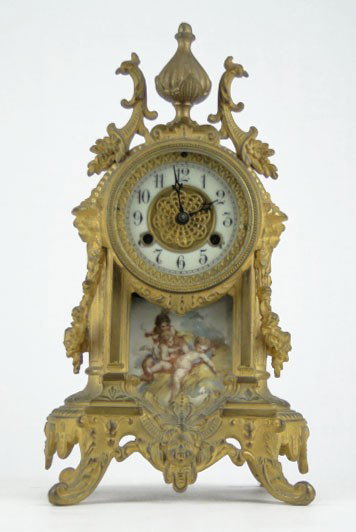 DORE BRONZE FRENCH TIME & STRIKE HAND PAINTED CLOC: DORE BRONZE FRENCH TIME & STRIKE HAND PAINTED CLOCK Hand painted Scene of Cherubs Porcelain Face Measures 13 Inches Tall 7 Inches Wide, WE WILL NOT SHIP THIS ITEM, CAN REFER LOCAL SHIPPER