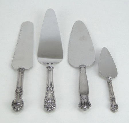 4 STERLING SILVER HANDLE SERVING PIECES: 4 STERLING SILVER HANDLE SERVING PIECES Consisting of 2 Large Pie or Cake Servers, Cake Cutter and Small Cheese Spreader The Largest Being 9-1/2 Inches Long, SHIPPING $20 PLUS INS