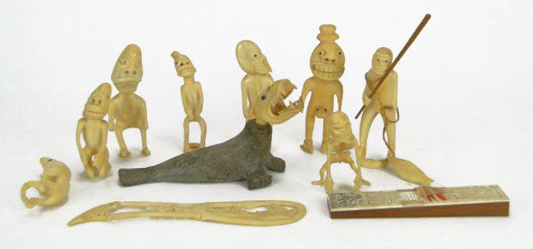 LOT VINTAGE INUIT IVORY & BONE TUPILAK FIGURES: LOT VINTAGE INUIT IVORY & BONE TUPILAK FIGURES Consisting of 11 Items Alaskan Eskimo Pieces to Include a large Stone Walrus with Deity Head, Multiple Carved Deities and a Cribbage Board and Dog Sled P