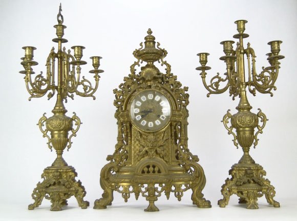 VINTAGE LARGE ORNATE CONTINENTAL BRONZE CLOCK: VINTAGE LARGE ORNATE CONTINENTAL BRONZE CLOCK German Clock Works, Porcelain Numbers, Gargoyle Cartouche to Front, Stands on 5 Legs, 23 Inches Tall , 14 Inches Wide & 3-1/2 Inches Deep, WE WILL NOT SHI