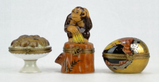 3 HAND PAINTED LIMOGES PORCELAIN PILL BOXES: 3 HAND PAINTED LIMOGES PORCELAIN PILL BOXES One of a Monkey with Bananas, Chick Hatching From Egg, and Fruit Centerpiece Tallest Measures Approximately 3 Inches, SHIPPING $20 PLUS INS