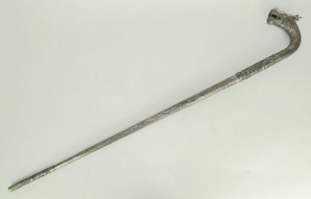 VINTAGE CHINESE DRAGON HANDLE SILVER SWORD CANE: VINTAGE CHINESE DRAGON HANDLE SILVER SWORD CANE with Reposse Silver Design Jeweled Features of Turquoise, Coral NOTE Some Jewels Missing Measures Approximately From Horns to Tip 38 Inches Long, WE WIL