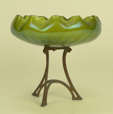 LOETZ ART NOUVEAU ART GLASS COMPOTE: LOETZ ART NOUVEAU ART GLASS COMPOTE Green Iridescent Ruffled with Metal Tripod Stand Measures Approximately Overall 7-1/2 Inches Tall 8 Inches Diameter, SHIPPING $35 PLUS INS