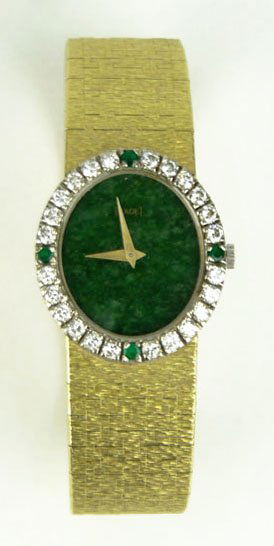 18KT VINTAGE EMERALD & DIAMOND PIAGET WATCH: 18KT VINTAGE EMERALD & DIAMOND PIAGET WATCH With Malachite Dial Mechanical Movement Emerald & 1-1/2ct Diamond Bezel Approx 40.3dwt, SHIPPING $20 PLUS INS