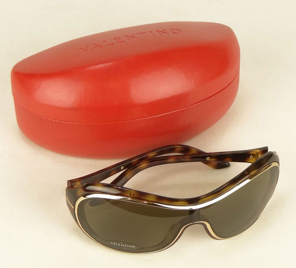 PAIR OF VALENTINO DESIGNER SUNGLASSES: PAIR OF valentino DESIGNER SUNGLASSES NEW IN CASE gold with faux tortoise shell gold case, SHIPPING $20 PLUS INS