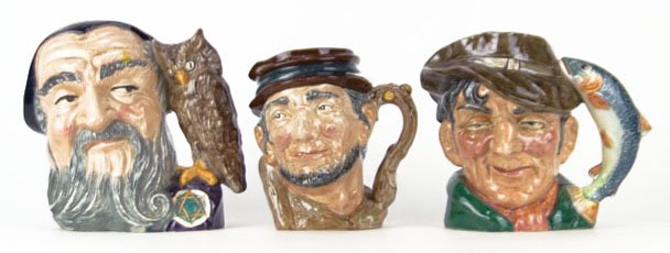 THREE LARGE ROYAL DOULTON TOBY MUGS: THREE LARGE ROYAL DOULTON TOBY MUGS TO INCLUDE "Johnny Apple Seed" Measures Approximately 6 1/4 Inches Tall, "Merlin" Measures Approximately 7 3/4 Inches Tall, & "The Poacher" Measures Approximately 7