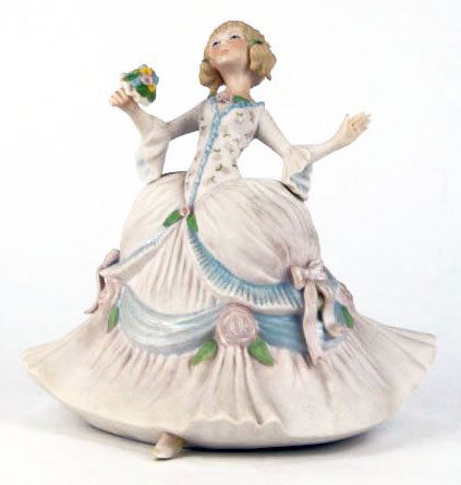 LOVLEY CYBIS FIGURINE OF A MAIDEN HOLDING FLOWERS: LOVELY CYBIS FIGURINE OF A MAIDEN HOLDING FLOWERS in a Forward Floral Dress Measures Approximately 8 Inches Tall 8 Inches Wide We Will Ship this Item for $35 Plus Insurance