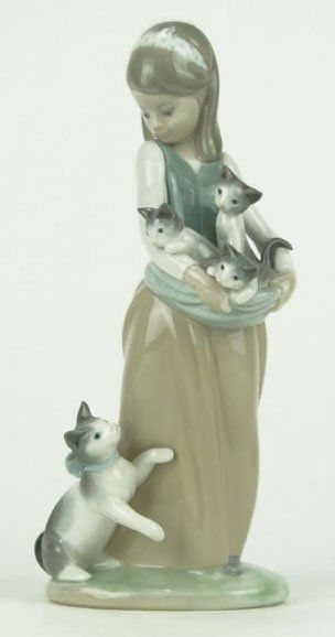 LLADRO GIRL WITH CAT'S PORCELAIN FIGURINE: LLADRO GIRL WITH CAT'S PORCELAIN FIGURINE #1309 Measures Approximately 9-1/2 Inches Tall Retired in 1985 with a Retail Price of $350 NO BOX WE WILL SHIP THIS ITEM FOR $30 PLUS INSURANCE