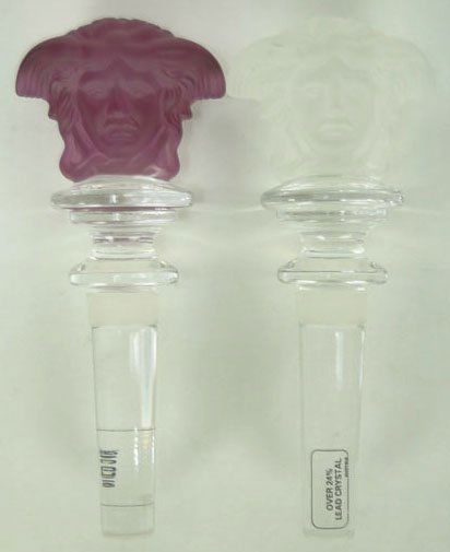 PAIR OF VINTAGE VERSACE WINE STOPPERS: PAIR OF VINTAGE VERSACE WINE STOPPERS Vintage Pair of Versace Wine Stoppers Made by Rosenthal with Double Sided Stopper Head Both in Original Box. One is Lavender and One is Frosted Crystal. Each Meas