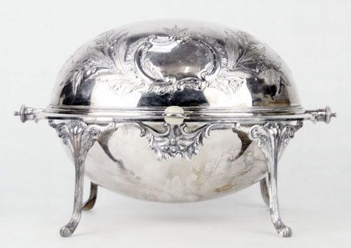 ANTIQUE ORNATE SILVER PLATE AND IVORY COVERED CASS: ANTIQUE ORNATE SILVER PLATE AND IVORY COVERED CASSEROLE Measures Approximately 8 1/2 Inches Tall by 13 Inches Wide, with Ivory Handle. Early 20th Century. WE WILL NOT SHIP THIS ITEM BUT CAN RECOMMEND