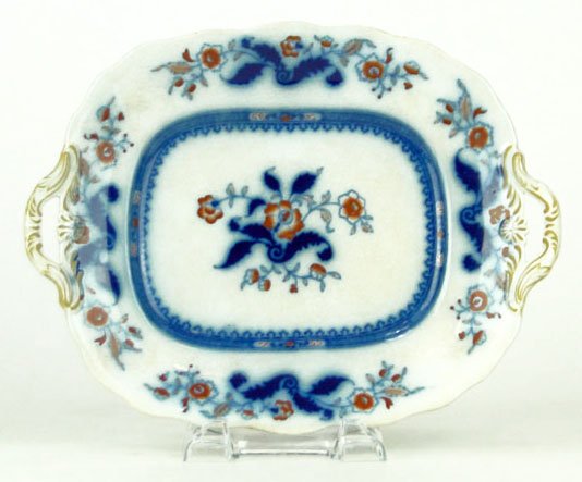 19C ENGLISH ORIENTALIST FLOW BLUE FOOTED TRAY: 19C ENGLISH ORIENTALIST FLOW BLUE FOOTED TRAY Measures Approximately 11 1/2 Inches from Handle to Handle by 2 3/4 Inches Tall. With Blue and Orange Flowers on a Cream Colored Ground Marked in Blue Sto