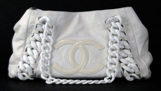 ORIGINAL COCO CHANEL WHITE LEATHER BAG: ORIGINAL COCO CHANEL WHITE LEATHER BAG Measures Approximately 15 Inches Wide by 10 Inches Tall. In New Condition. WE WILL SHIP THIS ITEM FOR $25 PLUS INSURANCE