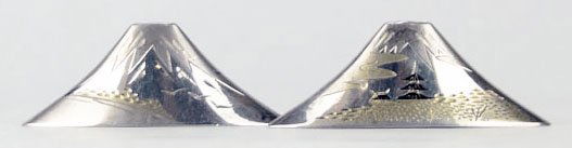 RARE JAPANESE ANTIQUE MOUNT FUJI STERLING SHAKERS: RARE JAPANESE ANTIQUE MOUNT FUJI STERLING SHAKERS Each Approximately 3 1/2 Inches long Shaped Like Mount Fuji with Gold Decorated Design. Weighing Approximately 1.3ozt WE WILL SHIP THIS ITEM FOR $20 P