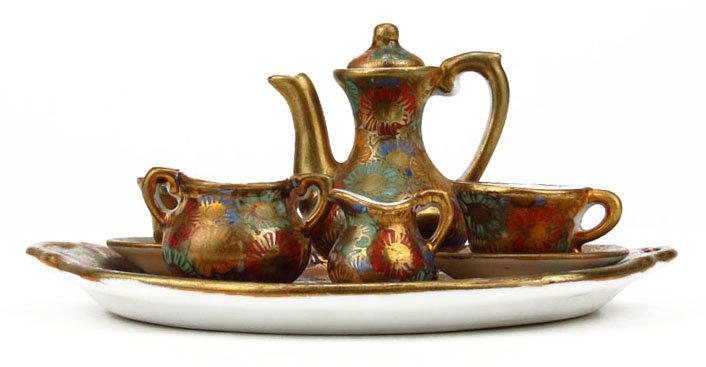 MINIATURE HAND PAINTED SATSUMA TEA SET: MINIATURE HAND PAINTED SATSUMA TEA SET Adorable Hand Painted Tea Set to Include Tea Pot, Two Cups and Saucers, a Creamer, and Sugar Bowl Sitting on Tea Tray. Tea Tray Measures 4-1/4" by 5-1/4". Talles