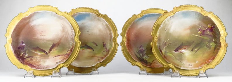 FOUR FABULOUS ANTIQUE LIMOGES FISH PLATES: FOUR FABULOUS ANTIQUE LIMOGES FISH PLATES Each Measures Approximately 9-1/2" in Diameter. By the LRL Limoges Company. Circa 1910. Each Plate Individually Painted by Muville. With Scalloped Antique Gol
