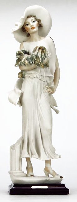GIUSEPPE ARMANI FIGURINE TITLED "SOPHIA": GIUSEPPE ARMANI FIGURINE TITLED "SOPHIA" #0636-F. Depicting a Traditionally Dressed Young Woman Holding her Dog. Measures Approximately 14-1/2" Tall and Sits on a 1" Base. Signed to Base. Comes in Ori