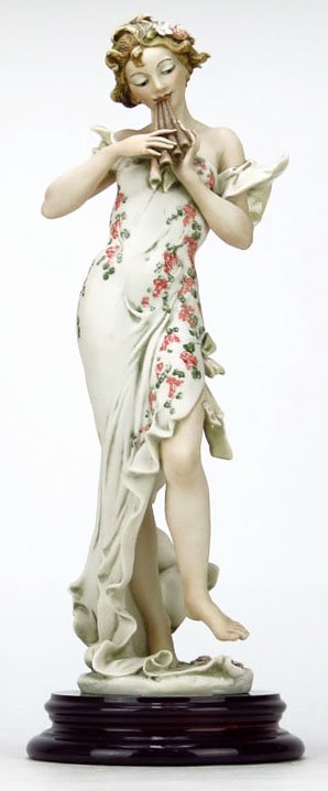 GIUSEPPE ARMANI FIGURINE TITLED "MELODY": GIUSEPPE ARMANI FIGURINE TITLED "MELODY" #656C. Measures Approximately 14" Tall Plus 1-1/2" Base. Depicting a Woman Playing a Flute. Comes in Original Box WE WILL NOT SHIP THIS ITEM BUT CAN RECOMMEND 