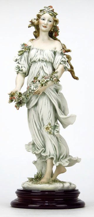 GIUSEPPE ARMANI FIGURINE TITLED "FLORA": GIUSEPPE ARMANI FIGURINE TITLED "FLORA" #212C. Measures Approximately 13-1/2" Tall Plus 1-1/2" Base. Depicting a Woman Holding a Basket of Flowers. Comes in Original Box WE WILL NOT SHIP THIS ITEM BUT