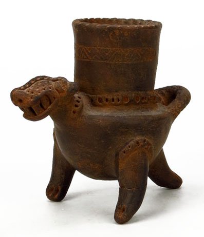 PRE-COLUMBIAN POTTERY VASSAL: PRE-COLUMBIAN POTTERY VASSAL Measures Approximately 6-1/2" Tall. Depicting a Three Legged Sacrificial Animal. Please Note: One Leg Has Been Repaired. With Impressed "R" to Base. WE WILL SHIP THIS ITEM