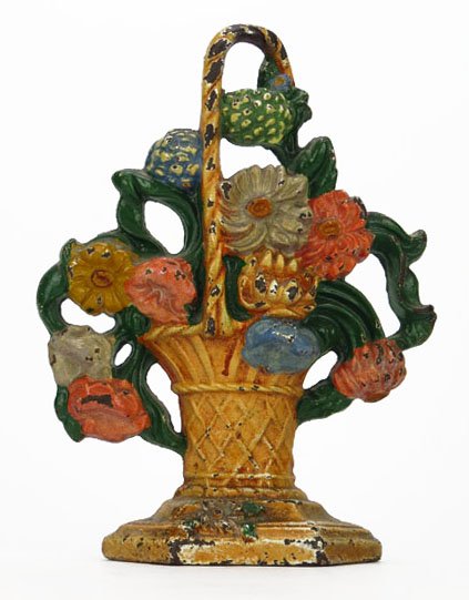ANTIQUE CAST IRON HAND PAINTED FLORAL DOORSTOP: ANTIQUE CAST IRON HAND PAINTED FLORAL DOORSTOP Measures Approximately 9" Tall. In The Form of a Floral Basket. Circa 1920's-1930's. Light Paint Loss, Otherwise Good Condition. WE WILL NOT SHIP THIS IT