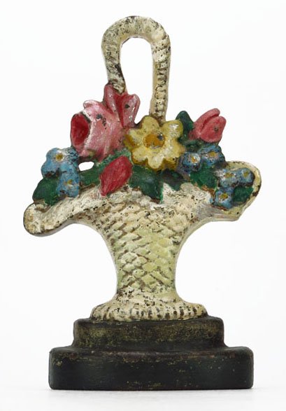 ANTIQUE CAST IRON HAND PAINTED FLORAL DOORSTOP: ANTIQUE CAST IRON HAND PAINTED FLORAL DOORSTOP Measures Approximately 8" Tall. In The Form of a Floral Basket. Circa 1920's-1930's. Light Paint Loss, Otherwise Good Condition. WE WILL NOT SHIP THIS IT