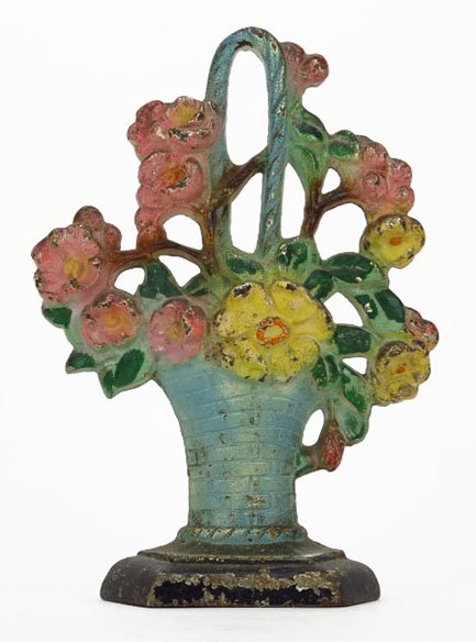 ANTIQUE CAST IRON HAND PAINTED FLORAL DOORSTOP: ANTIQUE CAST IRON HAND PAINTED FLORAL DOORSTOP Measures Approximately 7-1/2" Tall. In The Form of a Floral Basket. Circa 1920's-1930's. Light Paint Loss, Otherwise Good Condition. WE WILL NOT SHIP THI